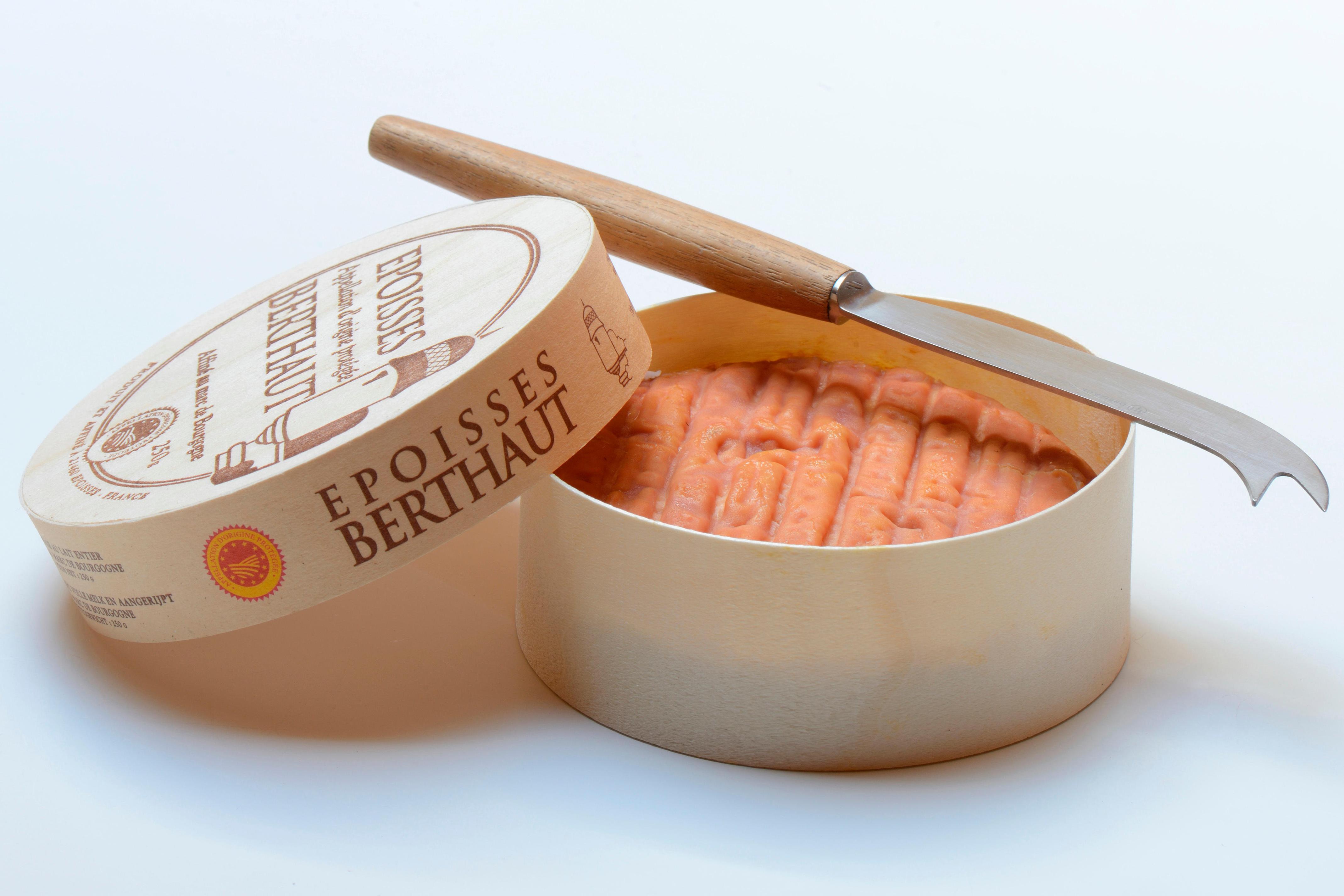 Epoisses Berthaut cheese in a wooden box with a cheese knife.